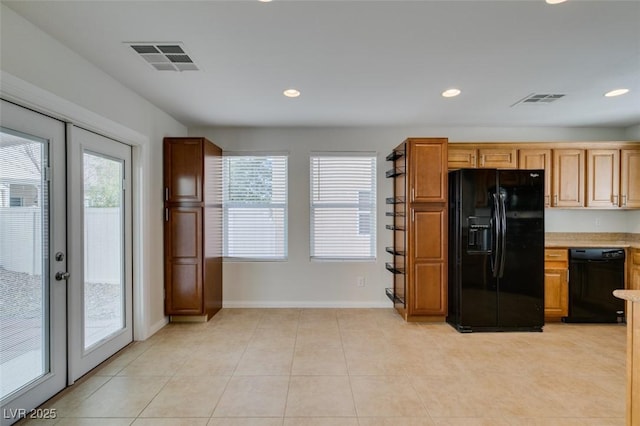 kitchen with visible vents, recessed lighting, black appliances, and light countertops