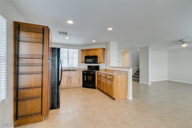 kitchen with visible vents, black appliances, a sink, recessed lighting, and a peninsula