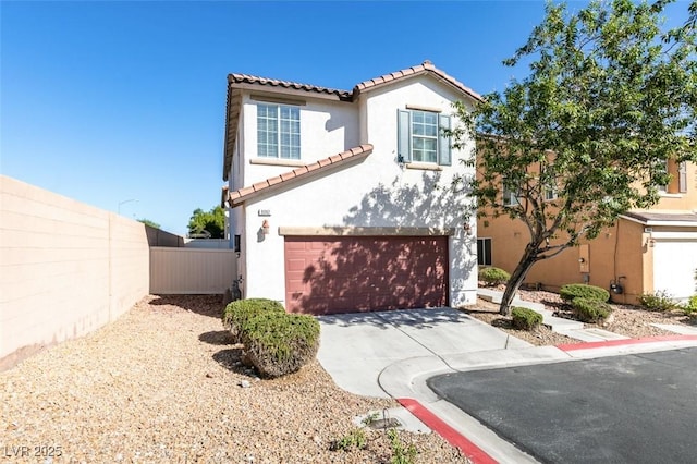 mediterranean / spanish house with stucco siding, a tiled roof, concrete driveway, and a garage