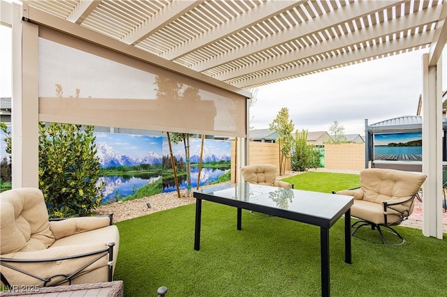 view of patio / terrace with a water view, a pergola, and fence