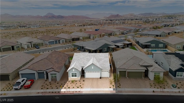 drone / aerial view with a residential view and a mountain view