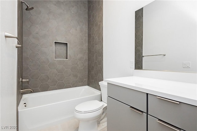 bathroom featuring washtub / shower combination, toilet, and vanity