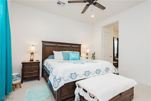 bedroom with baseboards, visible vents, recessed lighting, ceiling fan, and light colored carpet