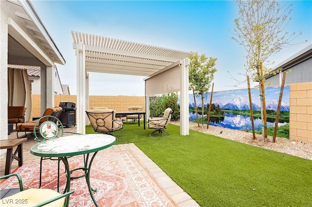 view of patio / terrace featuring area for grilling, fence, a pergola, and a water view