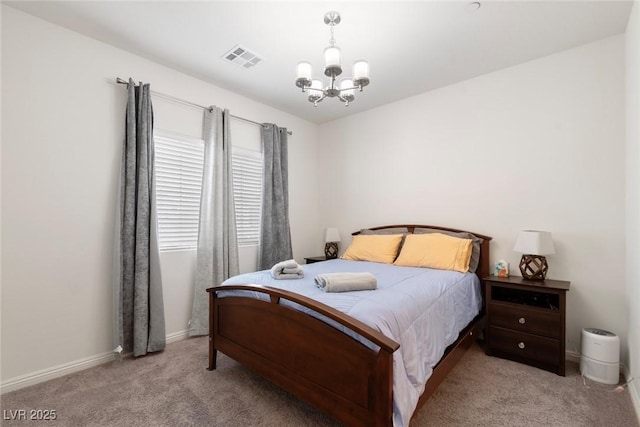 carpeted bedroom with a notable chandelier, baseboards, and visible vents