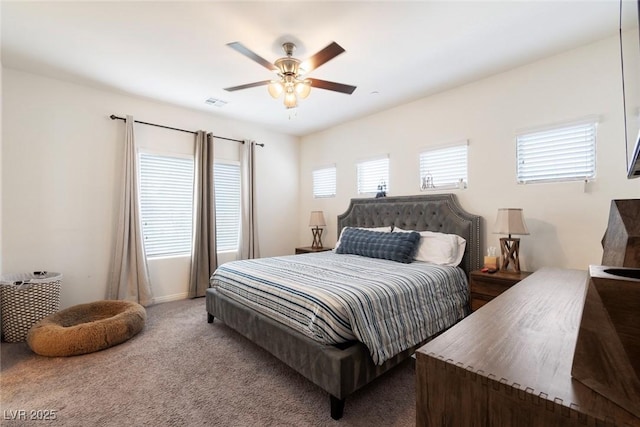 bedroom featuring a ceiling fan, visible vents, and carpet floors