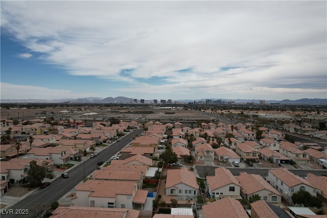 birds eye view of property featuring a residential view and a mountain view