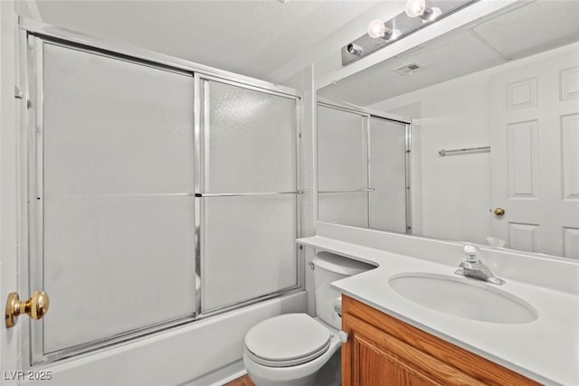 bathroom with visible vents, enclosed tub / shower combo, toilet, and vanity