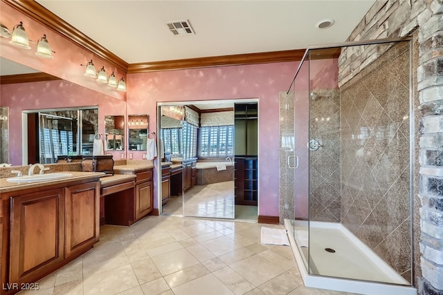 full bathroom with visible vents, a shower stall, tile patterned flooring, crown molding, and vanity