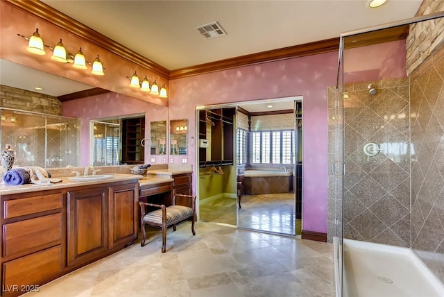 full bathroom with vanity, visible vents, baseboards, a stall shower, and crown molding