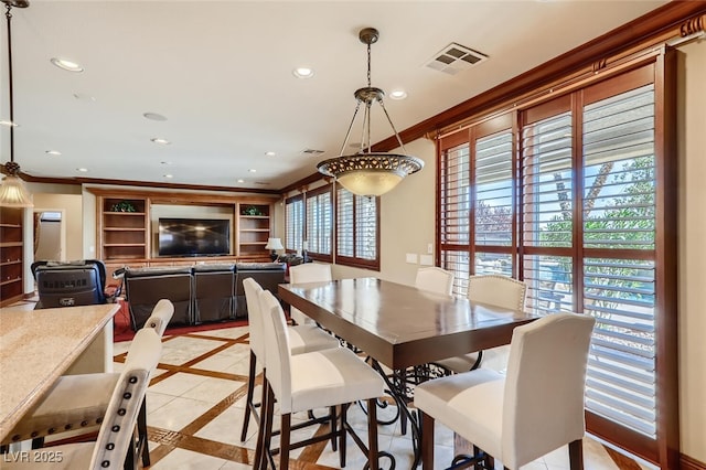 dining area with recessed lighting, visible vents, and crown molding