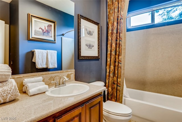 full bathroom with shower / bathtub combination with curtain, toilet, and vanity