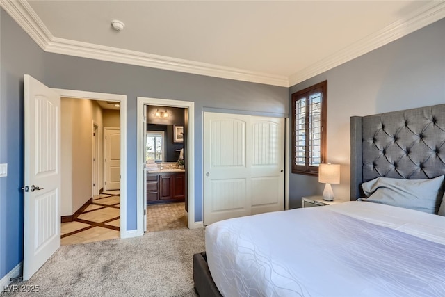 bedroom with light carpet, a closet, crown molding, and baseboards