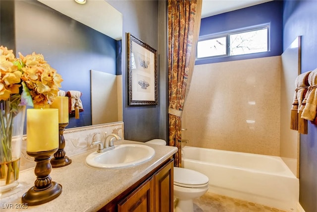 full bathroom featuring shower / bath combination with curtain, toilet, and vanity