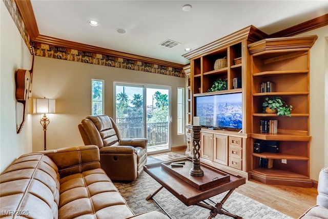 living area featuring recessed lighting, wood finished floors, visible vents, and ornamental molding