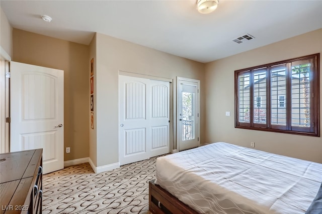 bedroom featuring a closet, visible vents, and baseboards