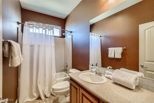 full bathroom featuring vanity, toilet, and shower / tub combo with curtain