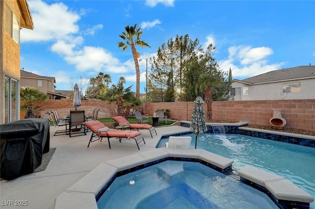 view of pool featuring a pool with connected hot tub, outdoor dining area, a fenced backyard, a grill, and a patio