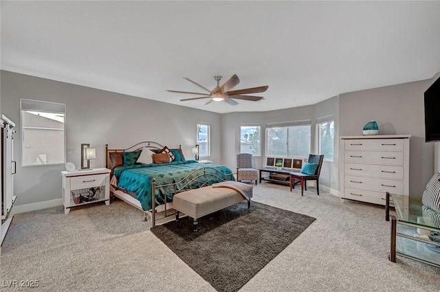 bedroom featuring baseboards, a ceiling fan, and carpet flooring