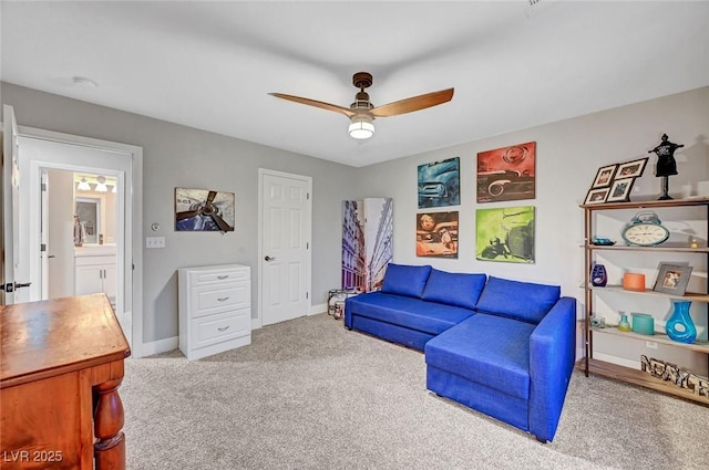 interior space with a ceiling fan and baseboards