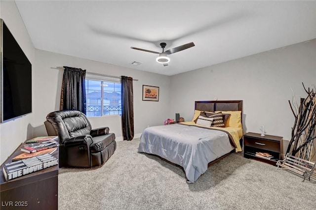 bedroom with visible vents, a ceiling fan, and carpet floors