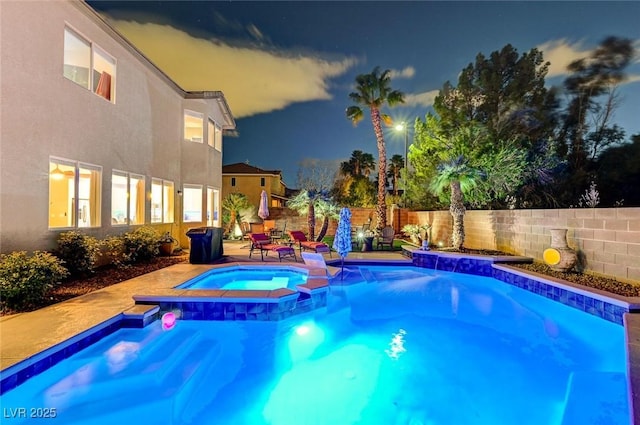 view of swimming pool featuring a patio, fence, and a pool with connected hot tub