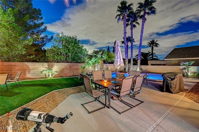 view of patio / terrace featuring outdoor dining space and a fenced backyard