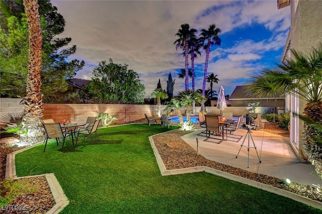 view of yard with a fenced in pool, a patio, and a fenced backyard