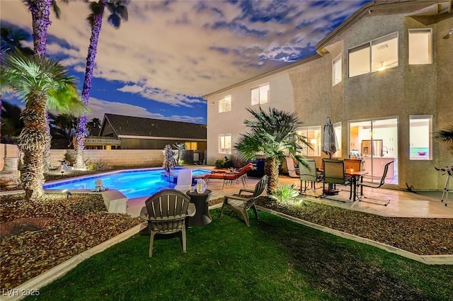 view of pool featuring a patio, a yard, a fenced backyard, and a fenced in pool