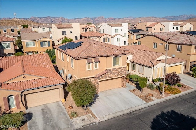 aerial view with a mountain view and a residential view