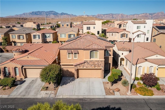 birds eye view of property featuring a mountain view and a residential view