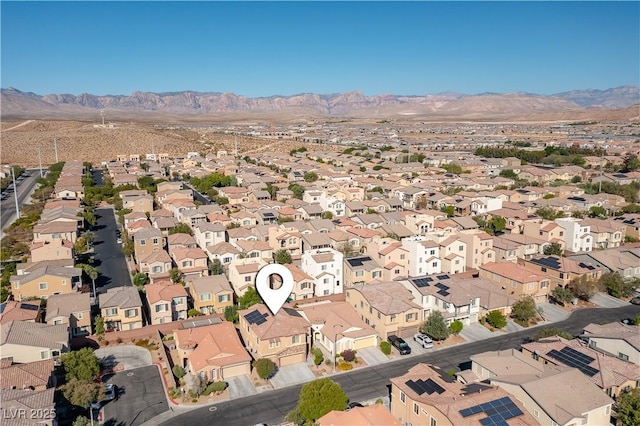 birds eye view of property featuring a mountain view and a residential view