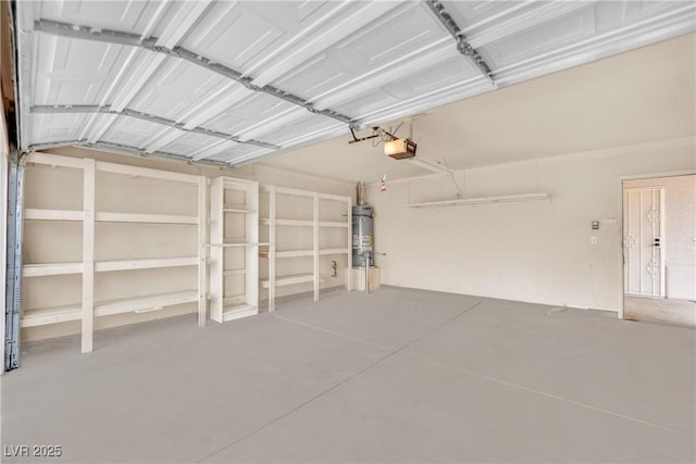 garage with strapped water heater and a garage door opener