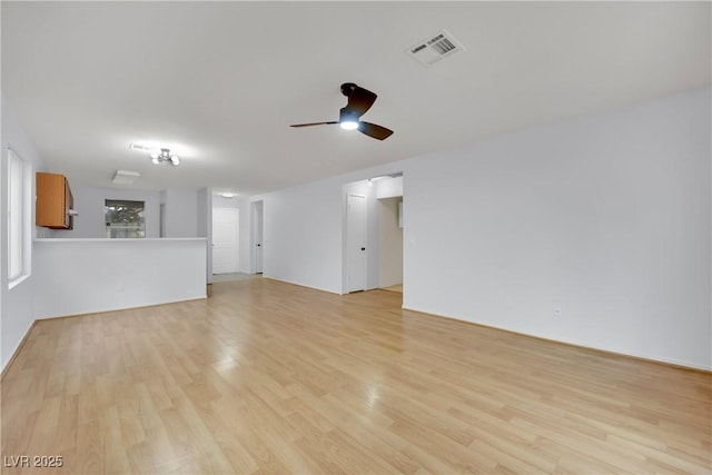 unfurnished living room with light wood-style floors, visible vents, and ceiling fan