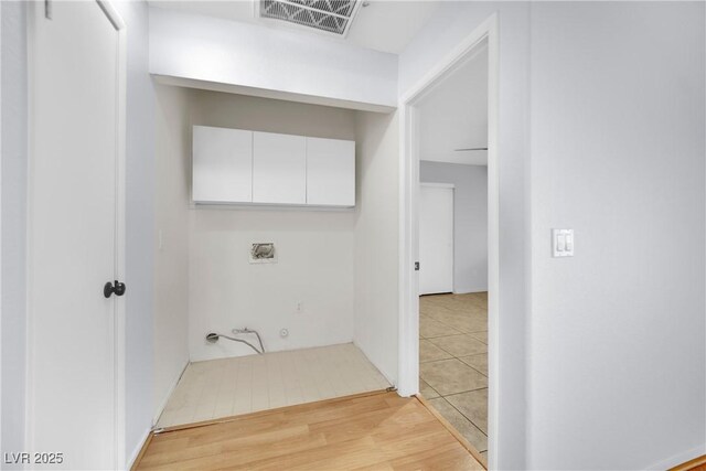 laundry room with visible vents, hookup for a washing machine, and light wood-style floors