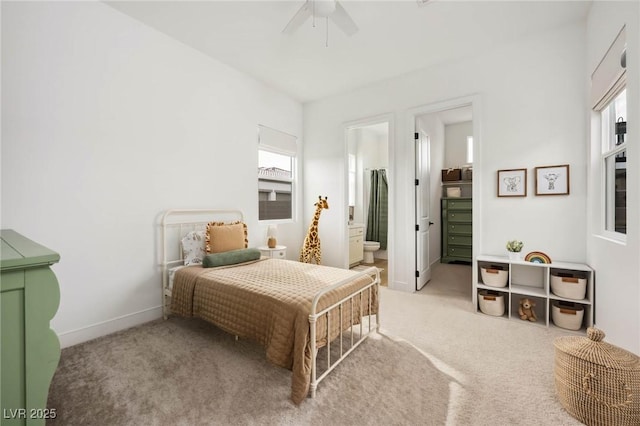 carpeted bedroom with a ceiling fan and baseboards