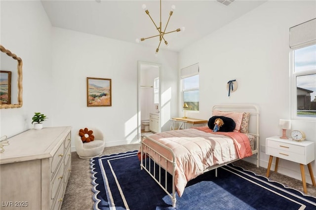 bedroom featuring baseboards, carpet floors, a chandelier, and ensuite bathroom