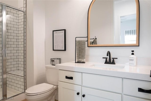 full bath with toilet, a stall shower, and vanity