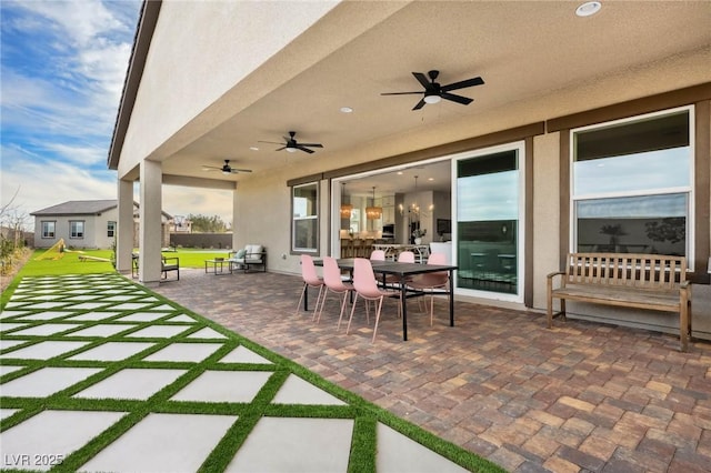 view of patio / terrace with outdoor dining space and ceiling fan