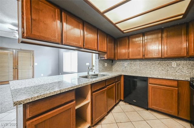 kitchen with a sink, backsplash, dishwasher, and light tile patterned flooring