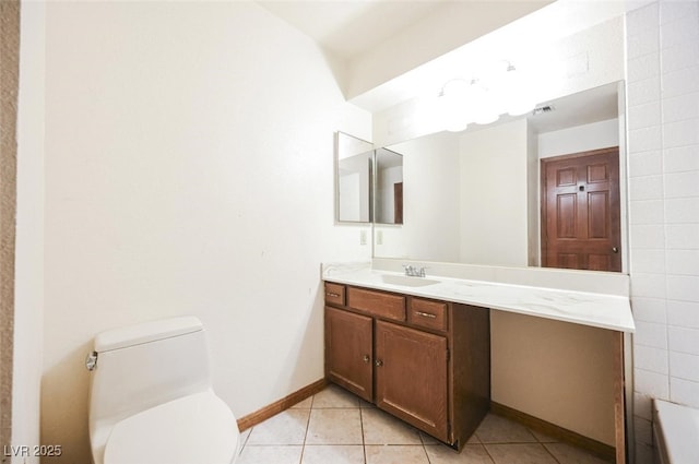 bathroom with tile patterned floors, baseboards, toilet, and vanity