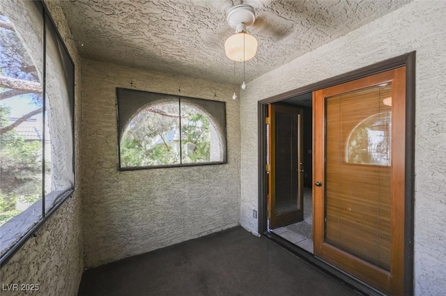 doorway to property featuring stucco siding