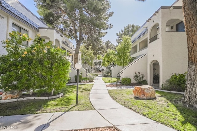 view of home's community featuring a lawn