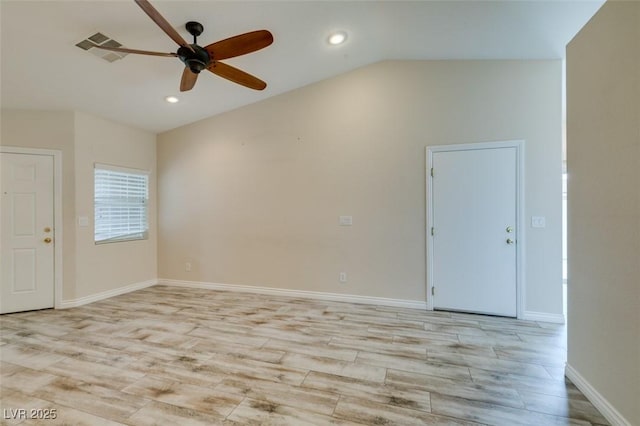 empty room featuring baseboards, light wood-style flooring, recessed lighting, ceiling fan, and vaulted ceiling