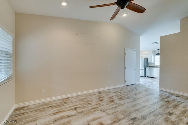 spare room featuring light wood finished floors, baseboards, ceiling fan, lofted ceiling, and recessed lighting