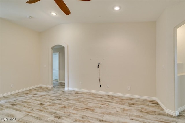 unfurnished room featuring recessed lighting, light wood-type flooring, arched walkways, and ceiling fan