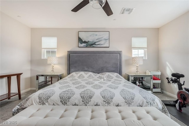 bedroom with baseboards, visible vents, carpet floors, and ceiling fan