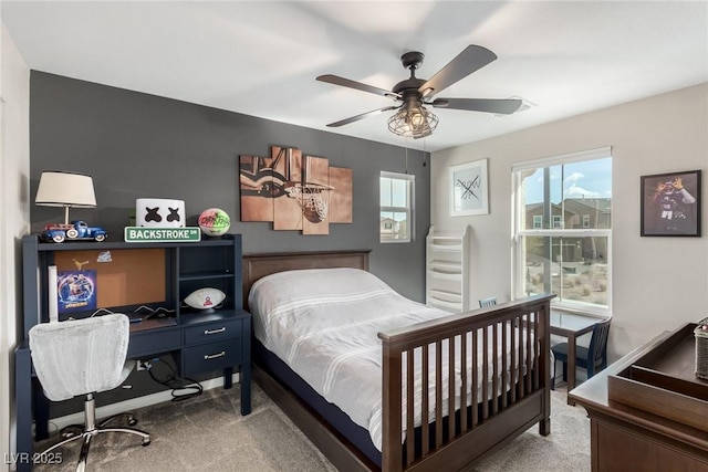 bedroom with baseboards, carpet, and ceiling fan