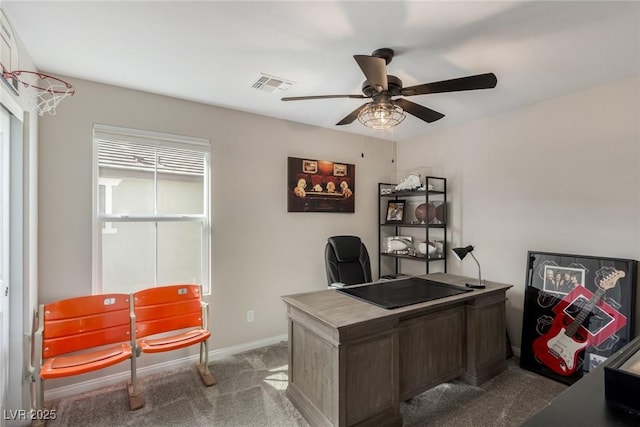 office space featuring visible vents, baseboards, a ceiling fan, and carpet floors