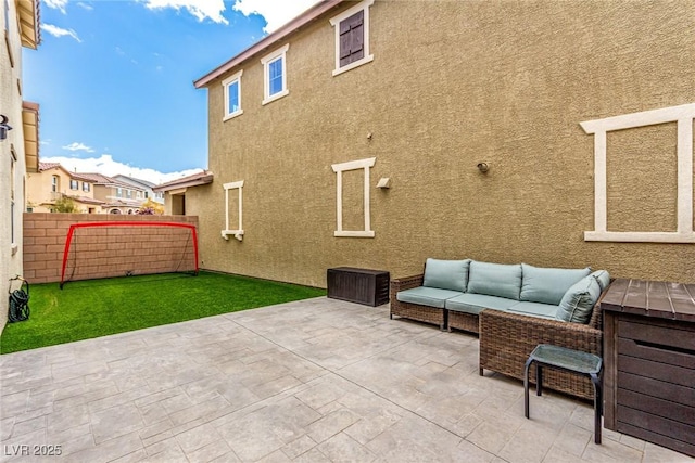 view of patio / terrace with outdoor lounge area and fence